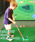 Child using Ultimate 70 By 70 Inch Golf Chipping Game Mat For Indoor And Outdoor Practice, setup in a room for fun training.