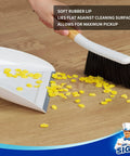 Portable Dustpan and Brush Set With Bamboo Handle in White For Quick Cleanups at Home or Office in use on wooden floor