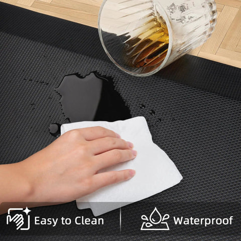 Extra Thick Anti Fatigue Kitchen Mat Nine Tenths Inch Thick Cushioned Standing Desk Mat With Memory Foam Comfort Non Slip Waterproof Rug For Kitchen Floor Office And Sink Twenty By Thirty Two Inches being wiped clean after liquid spill