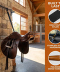 Portable Saddle T Hanger For Car And Trailer Heavy Duty Headrest Saddle Rack Organizer showing leather saddle in stable