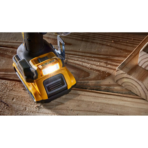 Close-up of 20V Max XR Brushless Cordless Drill And Driver Kit With Two Batteries And Charger showcasing base and LED light on wood surface.
