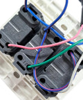 Close-up of Anbaochi 10A Wall Switch For Chandelier Hoist Lifter wiring connections with multiple color-coded wires.