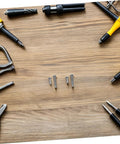 Hella Solid Mini Screw Kit For Eyeglass And Laptop Repair Packs Durable Self Tapping Screws on wooden surface with tools.