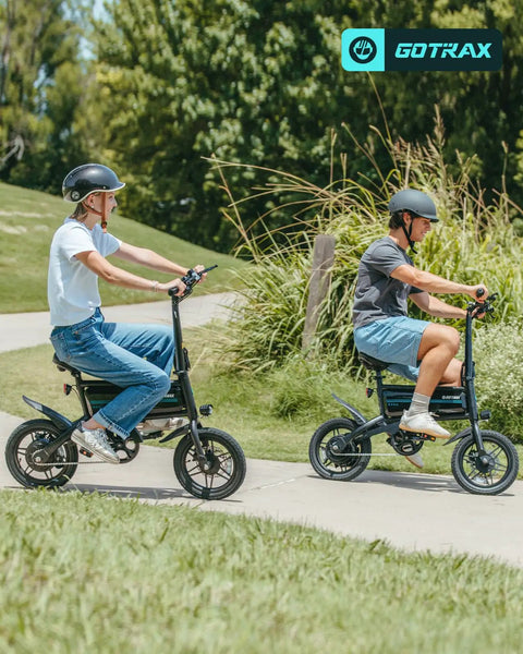 Two riders on Nano 14-Inch Folding Electric Bikes With 350W Motor 15.5 Mph Top Speed 25 Mile Pedal Assist Range outdoors