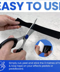 Grip Kit For Pedalboards With 10 Feet Of Heavy Duty Hook And Loop Tape And 6 Reusable Cable Ties being cut with scissors