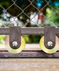 2 Sets Rock Solid 4 Inch V Groove Gate Roller Wheels Hardened Steel Double Ball Bearing 3000 lbs Capacity mounted on gate track.