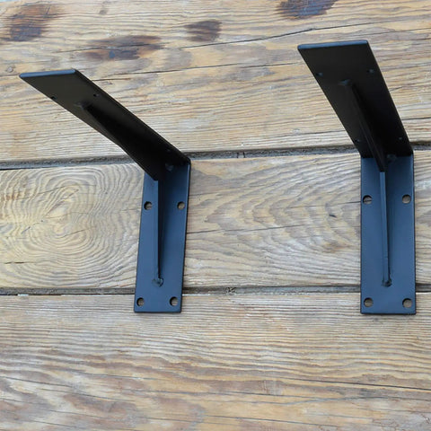Heavy Duty Farmhouse Shelf Brackets Badass Rock Solid Iron Wall Mounts Black Metal Industrial L Braces on wood surface.