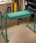 Garden Kneeler And Seat Flip Bench For Comfortable Outdoor Gardening With Thick Foam Cushion Sturdy Lightweight Frame Handy Handles To Stand Up Easy Converts From Kneeler To Seat In Seconds For Cushioned Kneeling Or Sitting in garage setting.