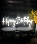 Birthday Neon Sign LED Wall Backdrop 23.6x9.45 Inches custom party light on stools with flowers, ideal for decor.