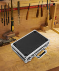 Hella Sturdy Aluminum Alloy Tool Storage Case With Reinforced Carry Handle And Lockable Portable Gear Box Organizer For Auto Mechanics And Hardcore Diy Crews on a workbench.
