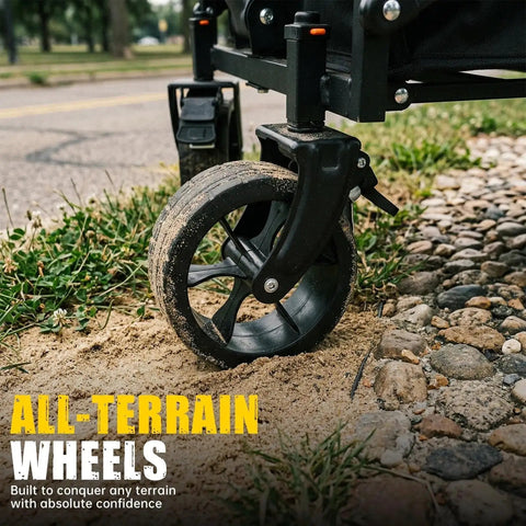 Close-up of all-terrain wheel on Foldable Wagon Cart With Drop Down Tailgate For Groceries And Gear, on sandy and rocky ground.