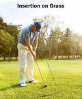 Golfer using Golf Alignment Sticks 2 Pack, 48 Inch Swing Trainer For Practice And Putting, Improve Swing Alignment on grass