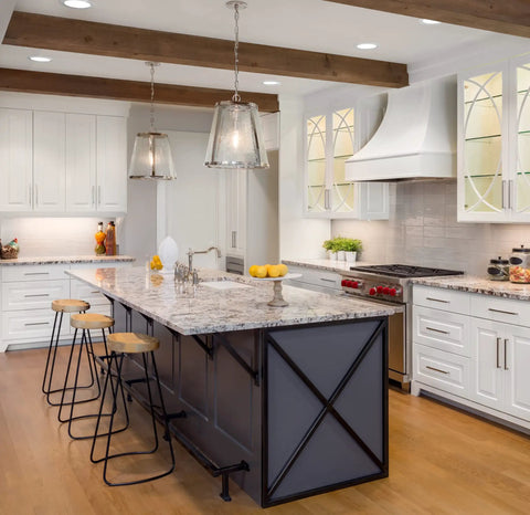 Bright kitchen featuring dimmable LED recessed ceiling lights, white cabinets, granite island, and pendant lighting.