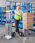 Heavy Duty Electric Stair Climbing Hand Truck With Power Lift Platform Handling All The Heavy Work So You Ride Easy Hauling Up To Three Seventy Five Pounds Across Floors Or Up Flights Of Stairs Smoothly in a warehouse setting with boxes.