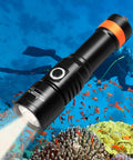 D530 1300 Lumen Titanium Dive Light With IP68 Waterproof Build illuminating coral reef underwater with diver in background