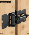Two Pack Self Closing Gate Hinges For Wood And Vinyl Fences Heavy Duty Gate Closers shown on wooden gate, black finish, side view