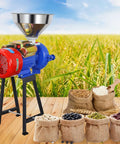 High Power 3000W Electric Grain Grinder Mill for dry cereals and grains with funnel, standing on wooden floor near bags of grains