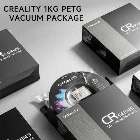 Creality 1kg PETG filament spool in vacuum packaging with boxes, labeled "CR Series 3D Printing Filaments"