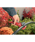 Automatic Garden Box Irrigation System Kit With 64 Sq Ft Coverage detail showing a hand using quick connect tool on hose