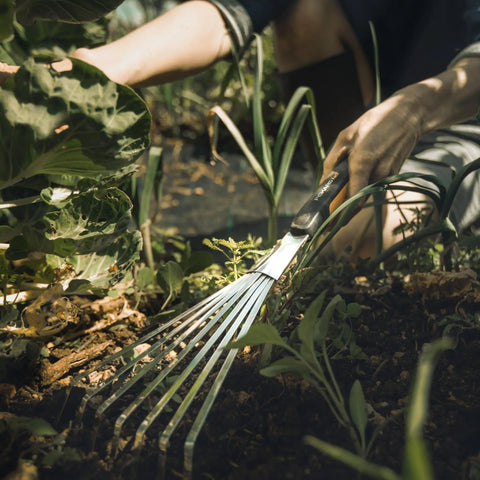 Person using Xact Hand Rake For Raised Garden Beds And Small Planters Workhorse Tool With Ergonomic Handle, Stainless Steel Head And Tines.
