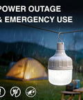 Go To All Night Camping Lantern Dimmable 8800mAh LED Light hanging in rain near tent, showing waterproof design.