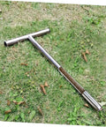 Stainless Steel Soil Sample Probe Tool With T Handle resting on grass, designed for easy field soil sampling of grains and fertilizer.