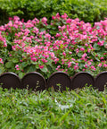 Brown PP plastic half-round garden border edging panels in flower bed showcasing lawn edge fence barrier in yard landscaping