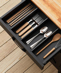 Slick Rolling Kitchen Cart With Microwave Stand And Storage Cabinet And Drawer, compact drawer filled with utensils.
