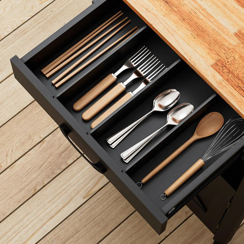 Slick Rolling Kitchen Cart With Microwave Stand And Storage Cabinet And Drawer, compact drawer filled with utensils.