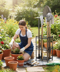 Beefy 35-Slot Steel Garden Tool Organizer in use beside a gardener with flowers, showing shovels and rakes stored on rack in garden setting