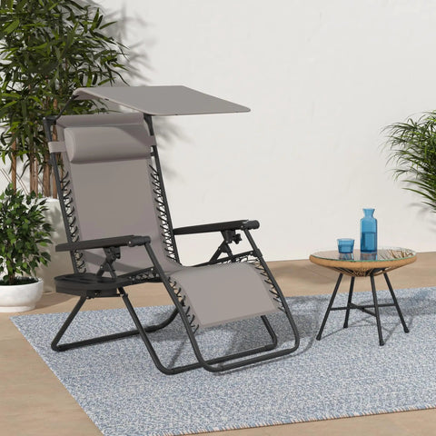 Zero Gravity Outdoor Folding Recliner Lounge Chair With Adjustable Canopy Shade Headrest And Side Tray For Easy Chill Sessions On Patio Deck Textilene Mesh Ice Gray on a rug beside a small table.