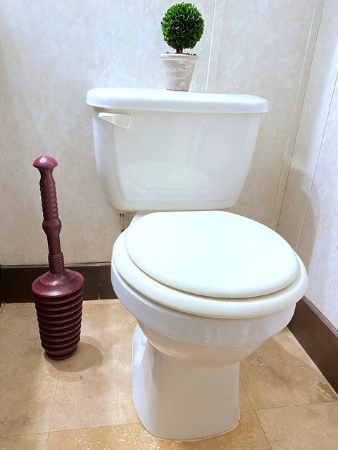 Heavy Duty All Purpose Plunger With Smart Air Release Valve And Eight Cup Capacity For Knocking Out Nasty Clogs In Toilets Kitchen Sinks Bathtubs And Garbage Disposals Top Shelf Plumbing Tool next to a white toilet.