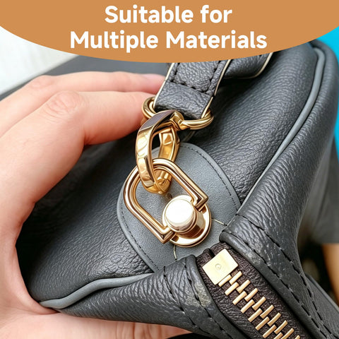 Gold D Ring Hardware Kit For Purse Straps With 360 Rotatable D Rings attached to a black leather bag, close-up view.