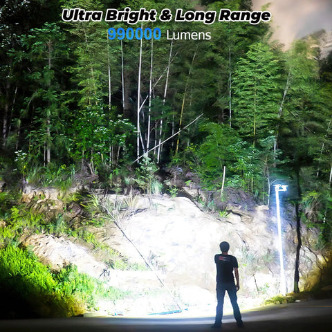 Person illuminating forest at night with Rechargeable LED Flashlight 80000 Lumens Ultra Bright Handheld Flashlight with 5 Modes