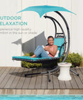 Outdoor Hanging Curved Steel Chaise Lounge Chair Swing With Built In Pillow And Removable UV Resistant Canopy Teal by poolside
