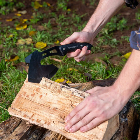 Outdoor Axe And Fixed Blade Knife Set With Full Tang And Wood Handle splitting wood outdoors, black handle visible