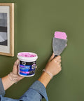 Applying DryDex Dry Time Indicator Spackling for interior and exterior surfaces, pink on application dries white, 32 oz tub
