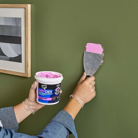 Applying DryDex Dry Time Indicator Spackling for interior and exterior surfaces, pink on application dries white, 32 oz tub