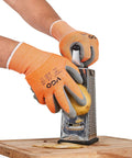 Person grating potato wearing ANSI A3 Cut Resistant Gloves with Latex Rubber Coated Grip, Size Large, Orange for hand protection.