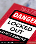 Close-up of 10 Red Keyed-Different Lockout Padlocks With Steel Cable Locks For Safe Lockout Tagout, OSHA compliant label