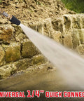 Rotating Turbo Nozzle For Pressure Washers 4000 PSI With Stainless Steel Filter And One Quarter Inch Quick Connect in use against stone wall