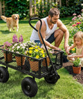 Man and child gardening with Beefy Heavy Duty Garden Wagon Cart With 880 Lb Capacity And All Terrain Solid Wheels 10 Inch Tires.