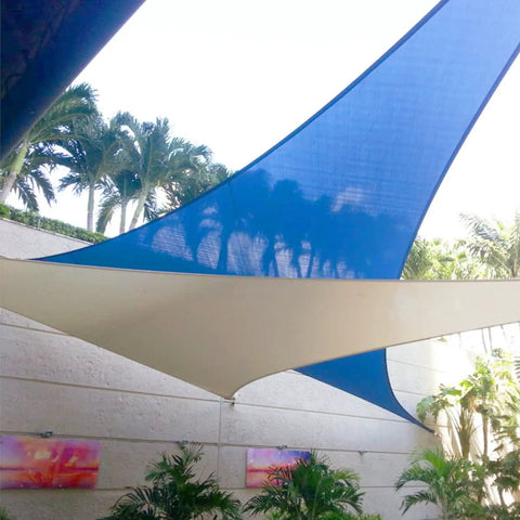 Beige Durable Waterproof Outdoor Triangle Sun Shade Sail 11x18x21.1 Ft with UV Block over patio area with plants