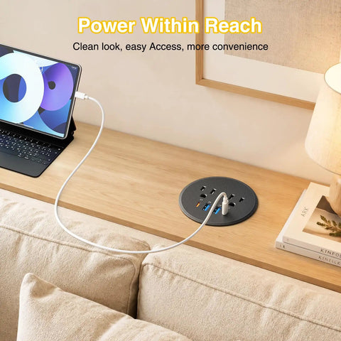 Three Inch Desktop Power Grommet With 35W USB C Fast Charging And Dual 18W USB A Outlets Black Six Foot Cord on a wooden desk.