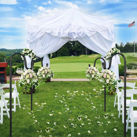 Outdoor wedding setup with 62 Inch Outdoor Shepherds Hook Bird Feeder Pole With 5 Prongs Base used for floral arrangements on green lawn.