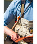 Angler using Mag Grab Rod Rack Magnetic Fishing Rod Holder Black Quick-Access One-Hand Mount attached to waders