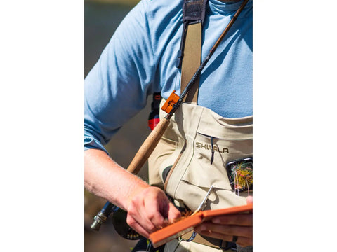 Angler using Mag Grab Rod Rack Magnetic Fishing Rod Holder Black Quick-Access One-Hand Mount attached to waders