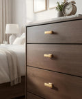 10 Pack Single Hole Cabinet Handles in Champagne Bronze for Kitchen Cabinets, shown on wooden drawers in bedroom scene