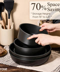 Hands stacking Detachable Handle 19 Piece Nonstick Cookware Set For Induction Cooktops, showcasing space-saving feature.
