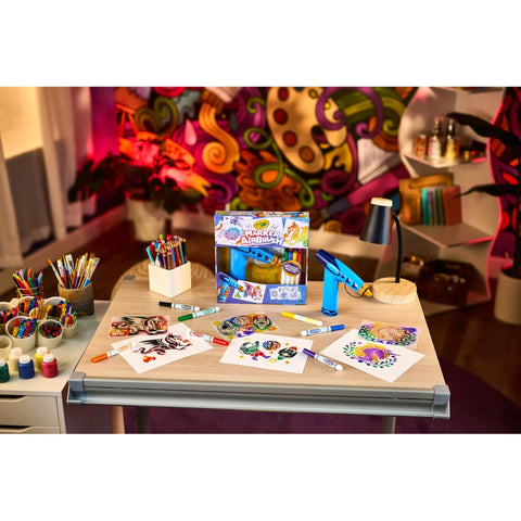 Rad Battery Powered Airbrush Marker Spray Craft Kit Smooth Glide Washable Ink Pens Plus Five Reusable Design Stencils on art table.